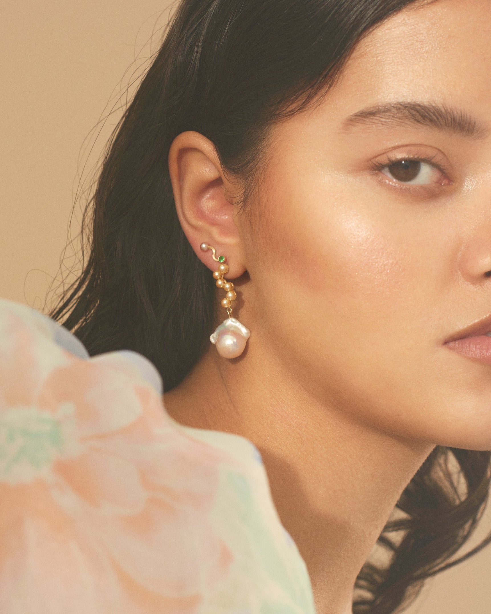 Woman wearing earrings with a soft, blurred background