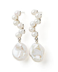 A pair of silver earrings featuring white freshwater pearls in a dangle style.